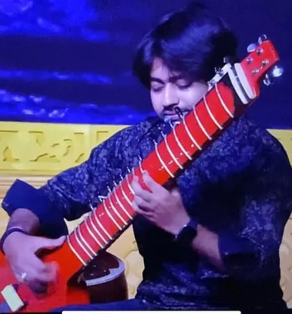 Playing the Zitar on stage in Ahmedabad. Live shows are a testament to a musician's skill and adaptability, and I am always ready for the challenge.