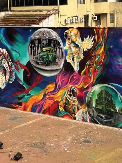Another perspective of the IIT Bombay mural, showing how different elements like astronauts, dream bubbles, and abstract colours come together to tell a complex story of innovation and ambition.