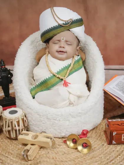 A sleeping newborn peacefully embodying the spirit of a Warkari pilgrim. This is a serene and powerful portrait for families to treasure.