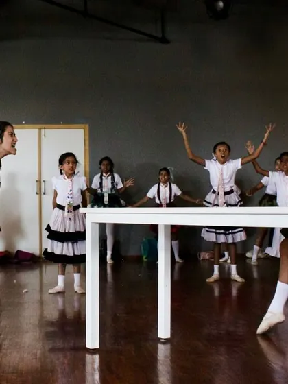 A rehearsal from our "Matilda - The Musical" summer school. These programs often include guest teachers for specialized skills like singing, providing a well-rounded performing arts education.