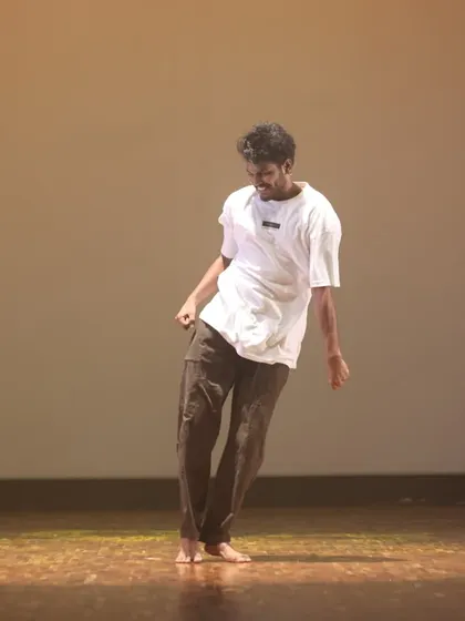 A smooth, flowing movement from an open-style dance piece. This style blends elements of hip-hop and Bollywood for a unique and expressive performance.
