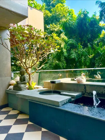 This angle captures the full effect of the balcony oasis, with the water feature, plants, and decor working together to create a peaceful retreat.