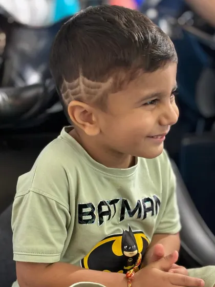 A close-up of the spider-web design, showing the precision and detail that goes into these fun hair tattoos.
