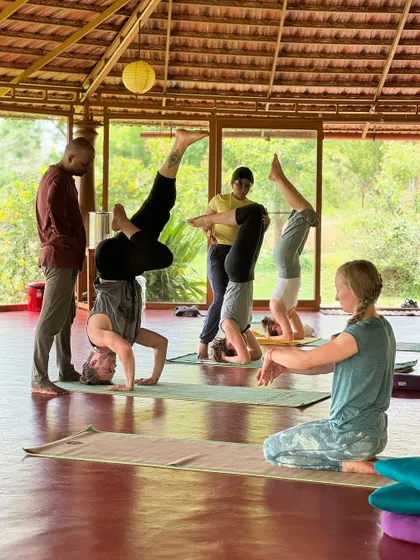 Captions will describe the specific yoga practice shown (e.g., "Practicing Sutra Neti, a traditional yogic cleansing technique," "A Hatha yoga class in our Chakra Hall," "Finding inspiration in our mistakes and using them as a platform for growth.").