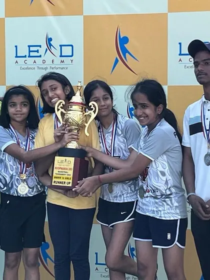The U-12 girls team with their runners-up trophy at the CNS tournament. Their will to prepare and compete was outstanding.