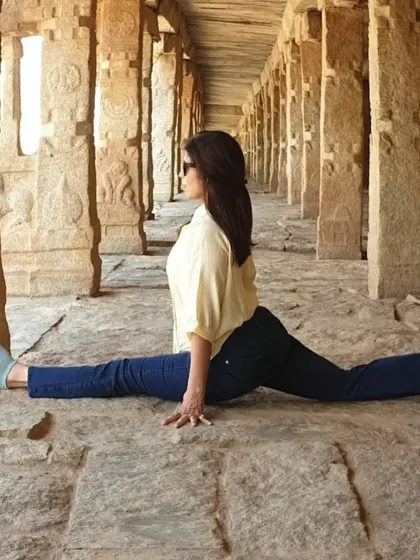 The full split, or Hanumanasana, in a historic setting. This pose represents a leap of faith and dedication, reminding us that with practice, anything is possible.