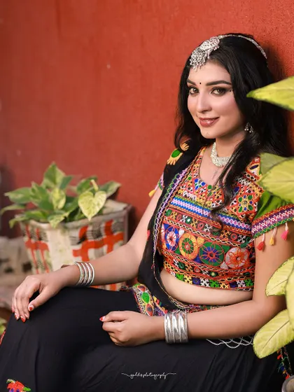 A vibrant and energetic series celebrating Navratri. The model is dressed in colorful Garba attire, and the photos capture the festive spirit through dynamic poses and joyful expressions.