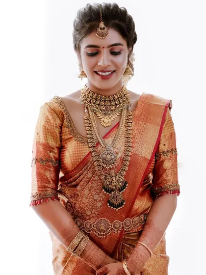 A beautiful close-up of the bride, her eyes closed in a serene smile.
