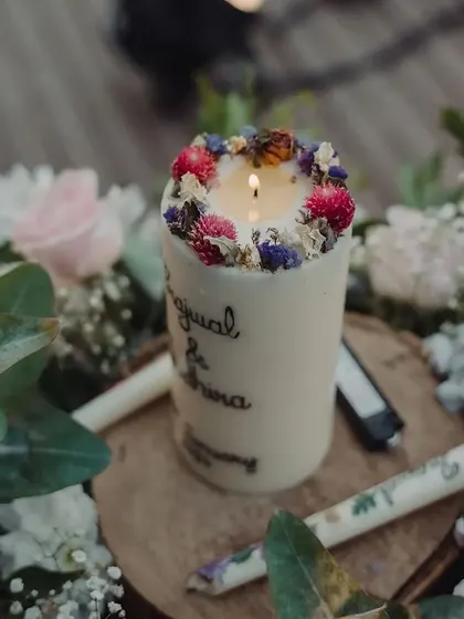 A symbol of their union. For their vow ceremony, we created this beautiful, personalized candle etched with the couple's names, which they lit together to mark the start of their new journey.