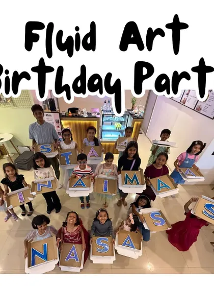 A fluid art birthday party is always a hit. The kids created personalized letter art, and the final group photo shows just how proud they are of their unique, colorful name signs.