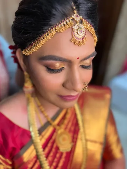 A close-up of classic Muhurtham gold eyes. I use a blend of shimmer and matte shadows to create a dimensional look that catches the light beautifully.