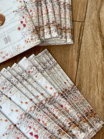 The crisp, clean look of vellum wraps and wax seals is a favorite of mine. For this suite, we used a tree of life wax seal to complement the wildflower and nature theme of the invitation design.
