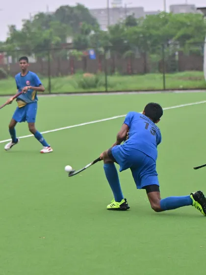 A player executing a powerful shot during a match.
