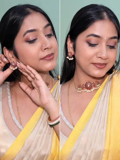 Adjusting the earrings of this beautiful temple jewelry set. The complete look is perfect for any festive or traditional occasion.