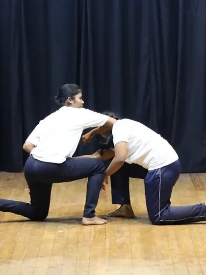 A participant practices a control hold during a partner drill. This technique is designed to neutralize a threat by controlling an attacker's posture and movement, a key skill we teach in our women's safety courses.