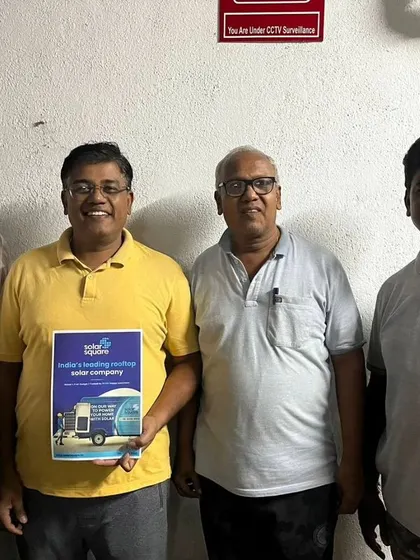 Our team with a group of customers, holding our solar guide.