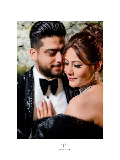 A close up portrait emphasizing the bride's flawless makeup and the couple's gentle interaction. We work to capture both glamour and intimacy.