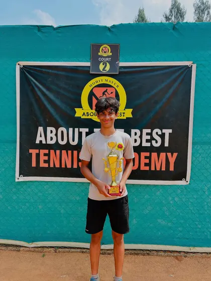 Our player Svar proudly displays his trophy after winning the CS7 U-14 Doubles title. This victory is a result of his dedication and teamwork.
