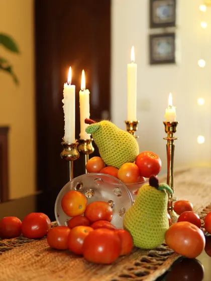 When life hands you tomatoes, make a centerpiece. This fun tablescape features my handmade crochet pears.