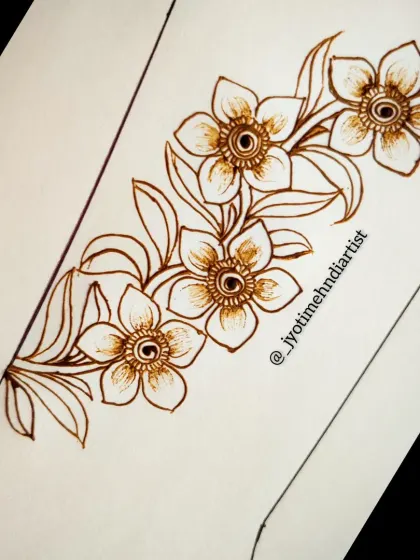 A simple floral vine pattern, perfect for learning basic shapes and flow in henna design.