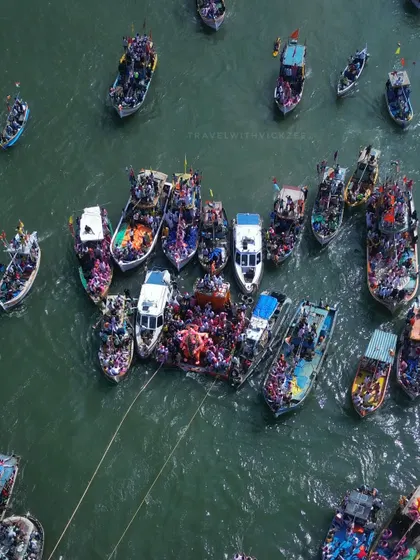 A closer, top-down view of the boats during the Lalbaugcha Raja Visarjan. You can see the intricate coordination as devotees prepare for the final farewell, a perspective impossible to get from the ground.
