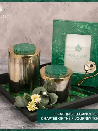 Crafting elegance for every chapter of their journey. This Malachite Collection hamper includes a photo frame and matching jars, all featuring the rich green stone, presented on a coordinating tray.