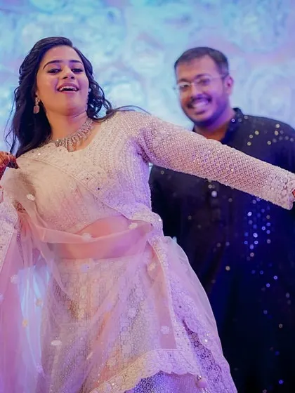 The bride takes center stage, dancing with joy and energy during her Sangeet performance. A moment of pure celebration and happiness.