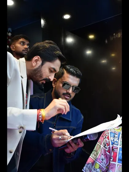 A behind the scenes moment, going over the event flow. Meticulous preparation is key to ensuring a smooth event, especially with VIPs involved.