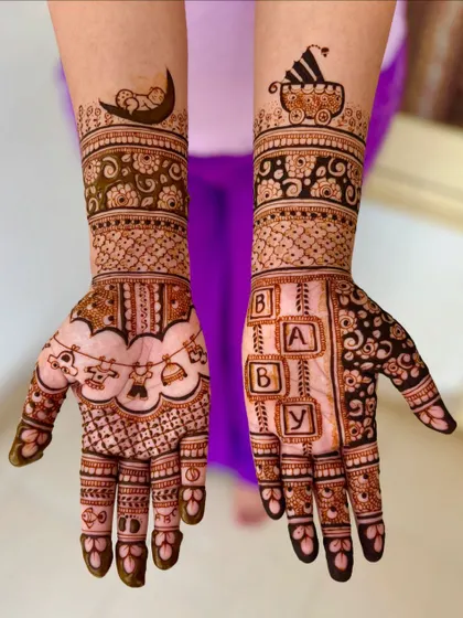 A clear, straight-on view of the playful baby shower mehendi with "BABY" blocks and a baby on the moon.