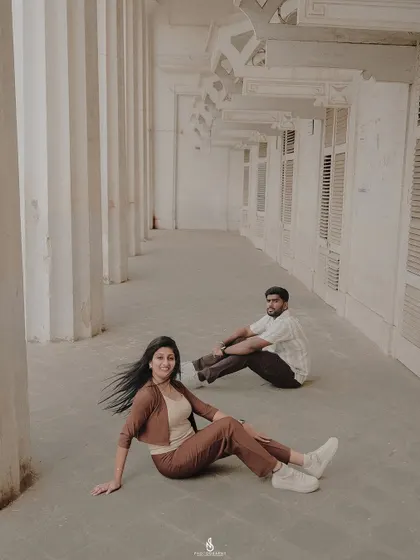 A creative composition in a long hallway, playing with distance and space to create an artistic portrait.