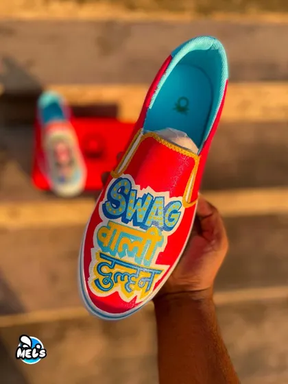 A hand-held shot of the "Swag Wali Dulhan" shoe in the sunlight.