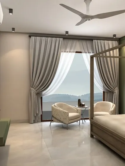 A cozy sitting area by the large window allows for soaking in the natural light and stunning Nainital scenery.