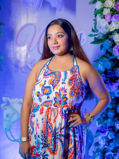 Posing at a beautifully decorated baby shower. I work with families to conceptualize games and activities that are unique to their celebration, making it a truly personalized experience.