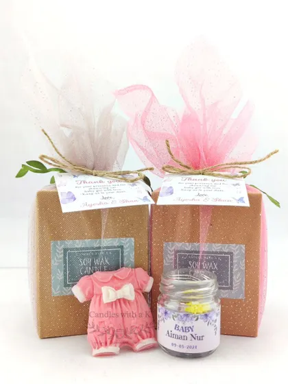 The complete baby announcement gift box, elegantly wrapped and personalized for the new arrival.