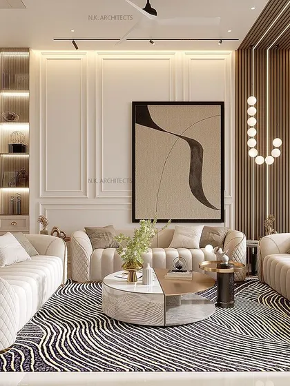 A simple interior can be elevated with detailed layering. This living room uses a beige palette, clean lines, and a mix of textures in the rug and sofas to create a space that is both simple and complete.