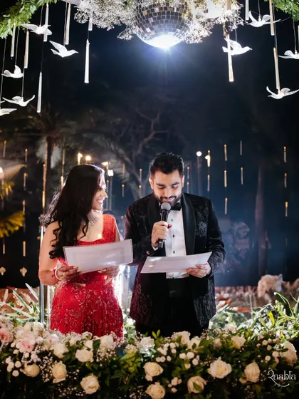 The couple reading their vows to each other, a heartfelt and personal moment during their wedding ceremony.