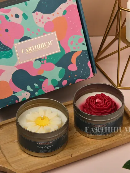 A daisy and a rose tin candle paired together in one of my colorful gift boxes.