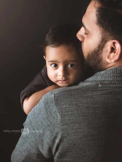 The comfort and safety a baby feels in their father's arms. This is a powerful and emotional portrait that every dad will treasure.