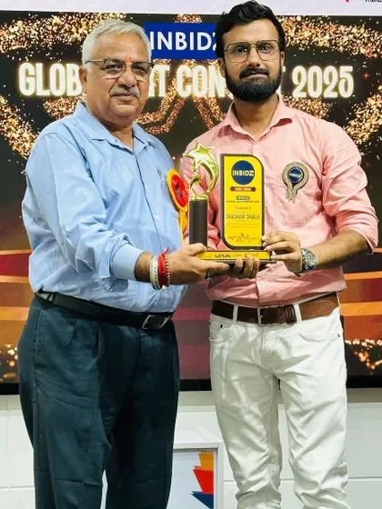 Receiving an award for my role as a judge in the Inbidz Global Art Competition. It's a privilege to support emerging artists.