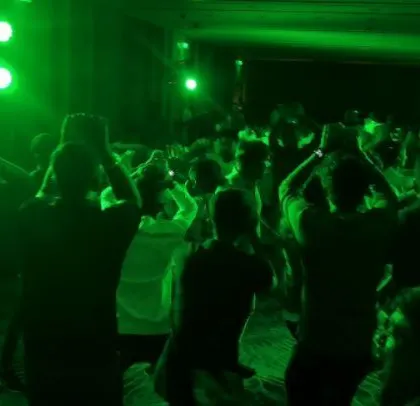 A corporate party for ABB with a strong Kannada music focus, lit in green.