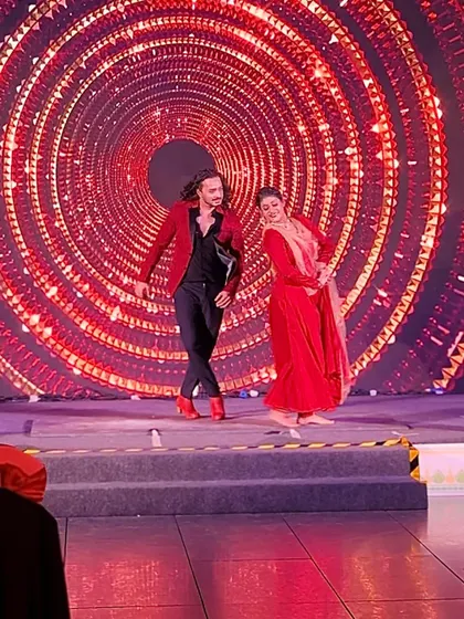 A full-stage view of a Flamenco-Kathak duet against a mesmerizing LED backdrop.
