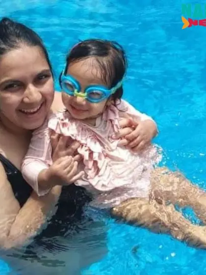 This mom and her daughter are all smiles during their one-on-one swim session.