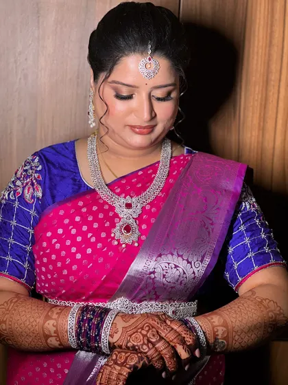 A moment of quiet reflection. The makeup looks elegant and sophisticated from every angle.