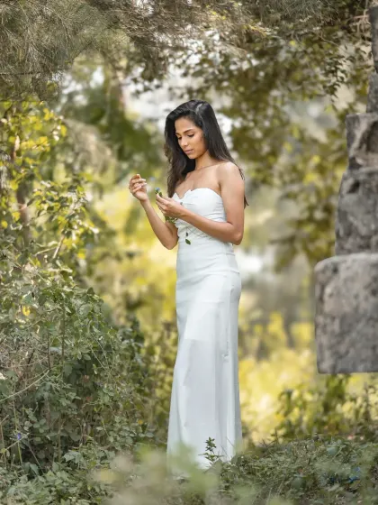 A serene and beautiful portrait in a lush, green setting. This shot from an editorial bridal shoot has a very natural and peaceful vibe.