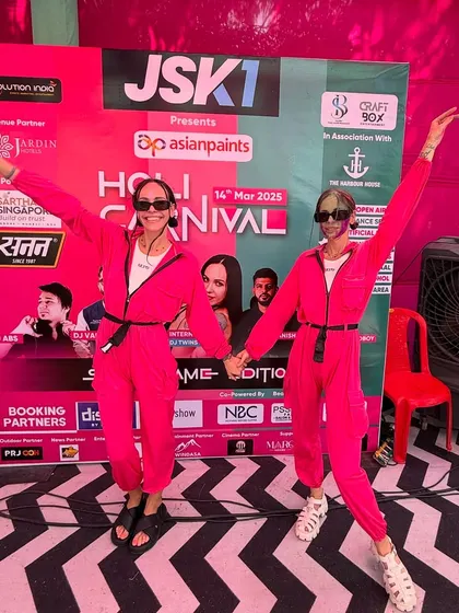 Ready to rock the stage at the JSK1 Holi Carnival. Matching outfits, big smiles, and ready to bring the twin power.
