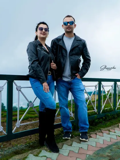 A cool, coordinated look for a pre-wedding shoot. The matching outfits and sunglasses give this couple's portrait a fun, cinematic vibe.