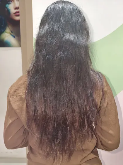 The "before" shot of a Nanoplastia treatment. This client came to us with frizzy, hard-to-manage hair, ready for a change.