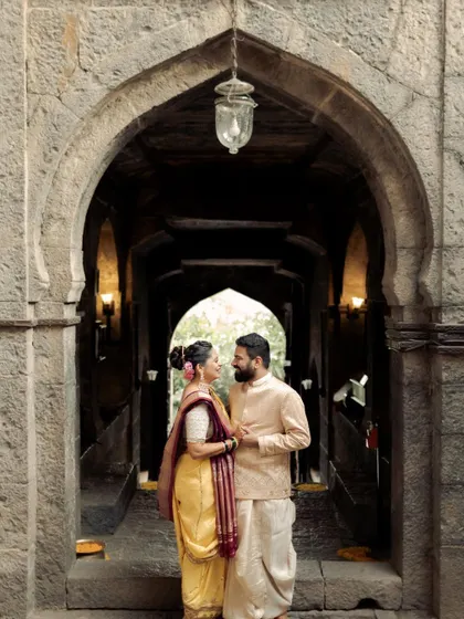Framed by the ancient stone archway of a temple, this couple shares a quiet moment. The historic setting adds a sense of permanence to their connection. I love finding these architectural frames that add depth and story to a portrait.