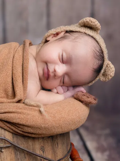 A sweet, sleepy smile from this little bear. Capturing these fleeting moments is what makes my job so rewarding.