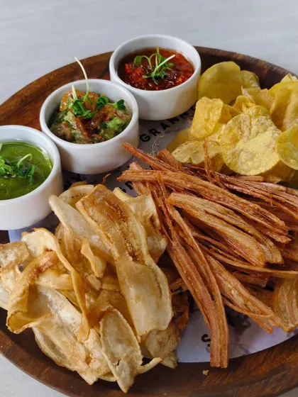 I take my snacks seriously. This platter features a variety of house-made crisps, including banana and lotus stem, served with three different dips.